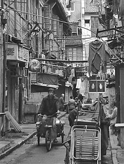 Rickshaw driver in alley